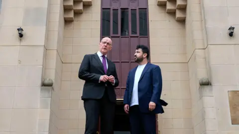 PA Media John Swinney and Imam Habib Rauf