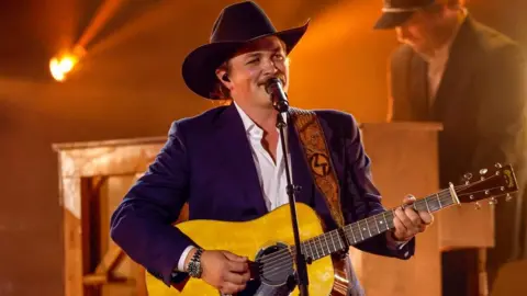 Getty Images Zach Top performing onstage with an acoustic guitar during the 59th Annual Country Music Association Awards at Bridgestone Arena on 19 November 2025 in Nashville, Tennessee