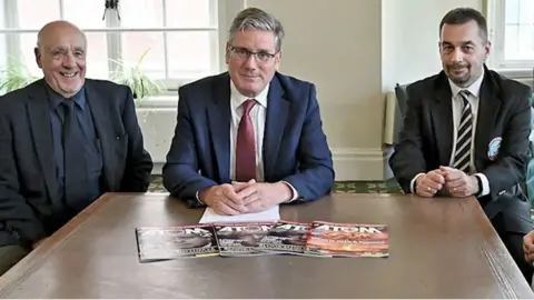 John Morris at a table with Sir Keir Starmer and two other nuclear veterans in 2021