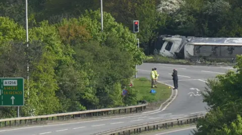 Richard Knights/BBC Tanker on its side by the road.