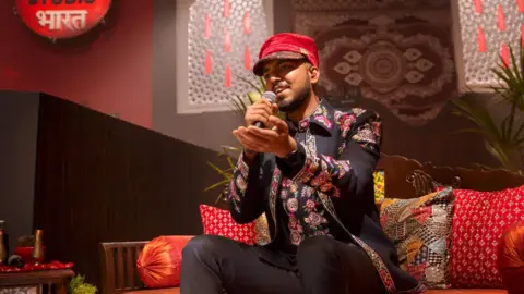 Utpal Udit dressed in a black jacket with colourful embroidery sings Kachaudi Gali at the sets of Coke Studio Bharat