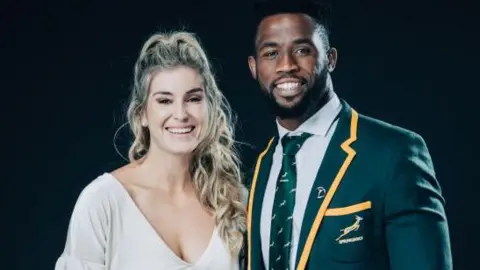 Getty Images Captain of Laureus World Team of the Year the South Africa Men’s Rugby Team Siya Kolisi and his wife Rachel Smith pose at the Mercedes Benz Building prior to the 2020 Laureus World Sports Awards on February 17, 2020 in Berlin, Germany.