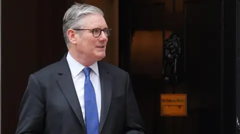 Keir Starmer standing outside No 10 Downing Street