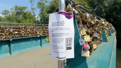 A bridge in Derbyshire that has thousands of locks attached to it 