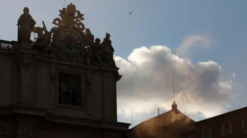 Reuters White smoke rlose from the chimney on the Sistine Chapel on Thursday, indicating that a new pope had been elected. The sky is blue with white clouds.