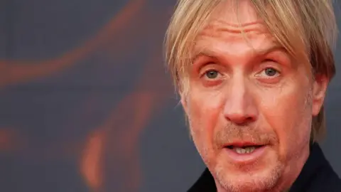 Getty Images A headshot of Rhys Ifans