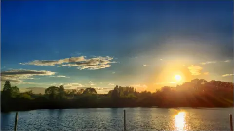 Tim Turan "Turned up early for band rehearsal at Lake Street Community Centre and just caught the sun on the lake".