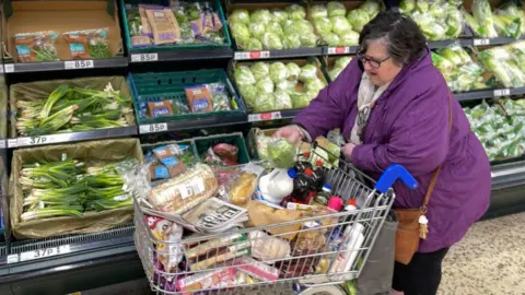 Getty Images Woman in supermarket