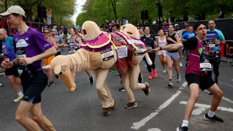 Reuters Couple running as a camel