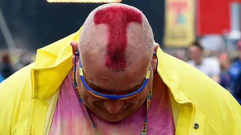 Getty Images A man with a shaved 'T' in his head