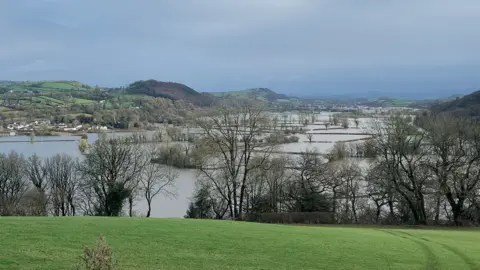 BBC The flooded Tywi Valley from Llangunnor Churchyard