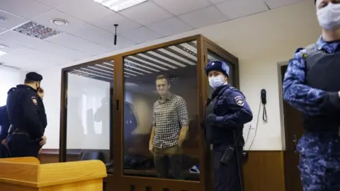 Reuters Alexei Navalny attends a hearing in Moscow, 20 February 2021