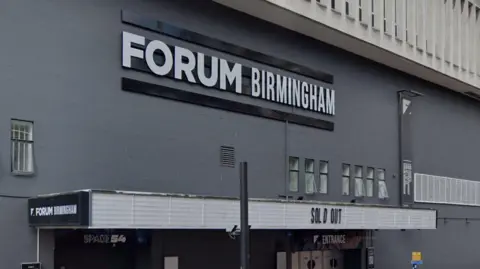 Google The front of The Forum in Birmingham. It's a gray building. 