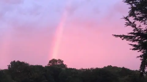 Sunny Jim Pink rainbow over Winterhead, Somerset