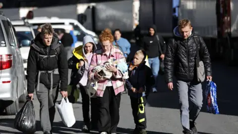 Getty Images Russians are seen attempting to leave their country to avoid a military call-up for the Russia-Ukraine war as queues have formed at the Kazbegi border crossing in the Kazbegi municipality of Stepantsminda, Georgia on September 27, 2022