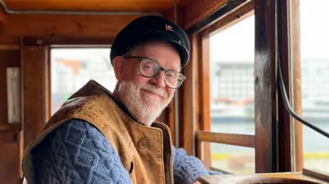 Morten Neset's grandfather owned the M/K Arnefjord during the WW2 and leased it in secret to the resistance effort to be used to rescue refugees from Norway following the German occupation