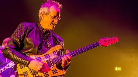 GETTY IMAGES Stuart 'Woody' Wood of the Bay City Rollers performs on stage in London in 2016