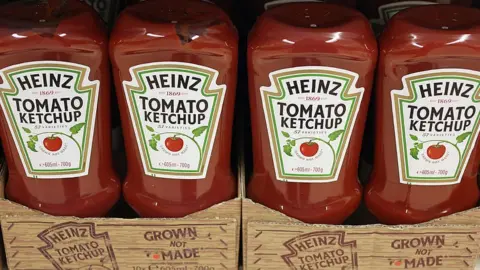 Getty Images Bottles of Heinz Tomato Ketchup on a shop shelf.