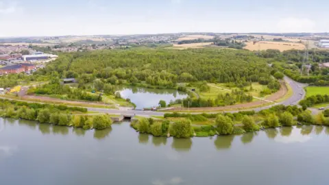 A body of water surrounded by trees.
