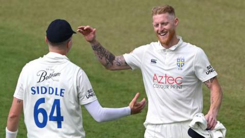Ben Stokes celebrates taking a wicket with Peter Siddle