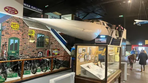 Vintage motorcycles along with a recreated cockpit of the Concorde aircraft