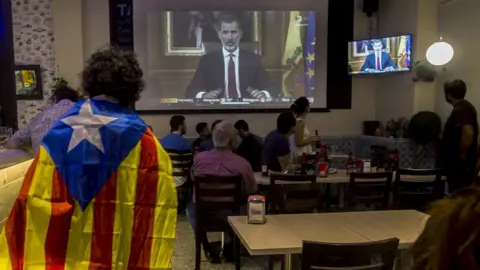 EPA People in a Barcelona bar listen to a broadcast by Spanish King Felipe, two days after the Catalonian referendum, 3 October 2017