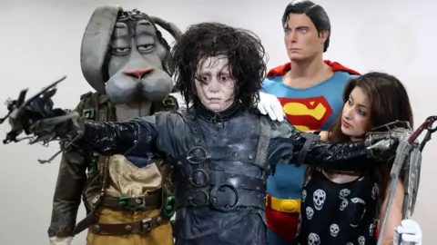 PA Johnny Depp's Edward Scissorhands outfit and and Christopher Reeve's Superman