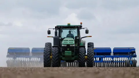 Bloomberg via Getty Images A farmer plants rice at a farm near El Campo, Texas, US, on Wednesday, March 4, 2026. The USDA forecasts US rice production at 208.5 million hundredweight for the 2025/26 crop year, as farmers plant more acres to offset lower yields per acre