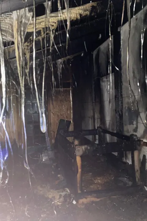 Youth Vision Black and charred remains of the fire.