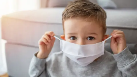 Getty Images young boy wearing a face mask