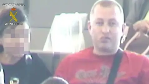 Guardia Civil Robert Dawes, pictured in a red T-shirt, during his arrest 