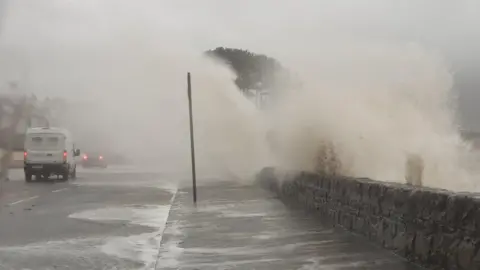 Martym/BBC Weather Watchers Extremely stormy on the coast at Warrenpoint. Massive waves breaking and flooding the shore road