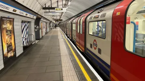 Tube train on Stockwell station platform