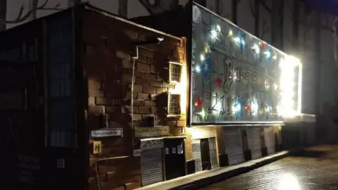 Karen Bones Barras lit up