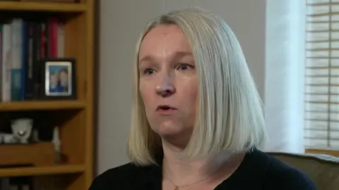 Louise Gibson, who has short blonde hair, speaking in a BBC interview