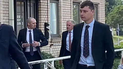 Andrew Turner/BBC Defendants arrive at Great Yarmouth Magistrates' Court