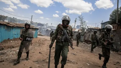 Getty Images Riot police disperse protesters in Kibera Slum using tear gas during the Azimio la Umoja-One Kenya protest over high living cost on July 21, 2023