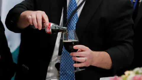 Carlos Barria/ Reuters A White House staff member from the presidential food service pours a Diet Coke.
