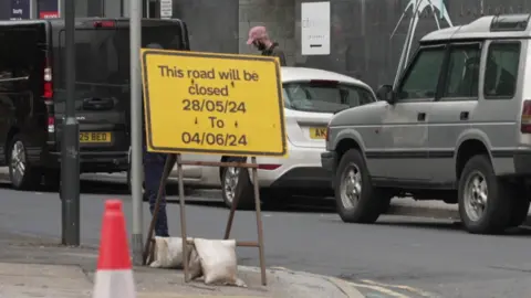 BBC Roadworks signage and traffic at the New York Street flyover in Leeds