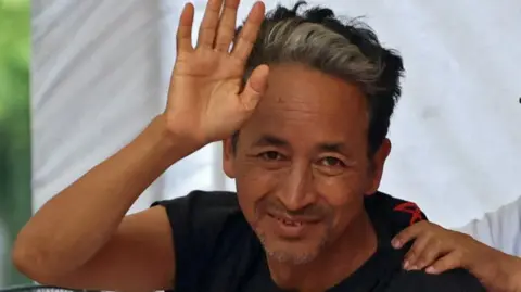 Sonam Wangchuk, an Indian education reformer, who has been on hunger strike, gestures as he sits on stage during a sit-in protest called by Cockroach Janta Party (CJP) demanding the resignation of Indian Education Minister Dharmendra Pradhan, at Jantar Mantar in New Delhi, India, July 17, 2026. REUTERS/Bhawika Chhabra