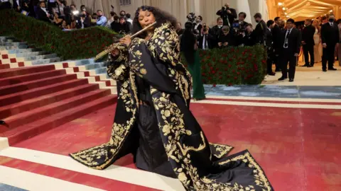 Getty Images Lizzo playing the flute