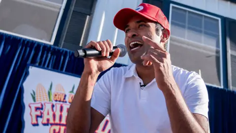 Getty Images Presidential hopeful Vivek Ramaswamy raps after doing a Fair Side Chat with Governor Kim Reynolds, at the Iowa State Fair in Des Moines, Iowa, on August 12, 2023