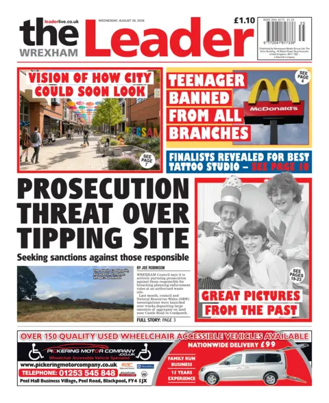 The Wrexham Leader Main headline: Prosecution threat over tipping site. Next to photo of a field with a pile of rubble heaped onto it.