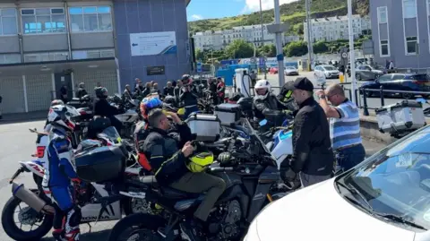 Visiting motorcyclists parked in the car park at the Sea Terminal in Douglas. 