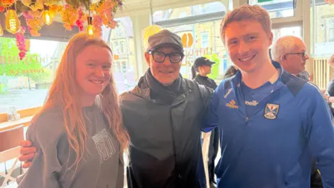 Thirty Nine Coffee Company Stanley Tucci with a young couple in a cafe in Ilkley.