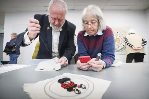 BBC Stitchers creating the Dundee Tapestry