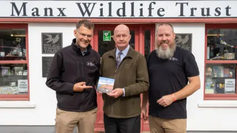 IOM GOVERNMENT Bill Henderson MLC with Leigh Morris and Graham Makepeace-Warne from Manx Wildlife Trust