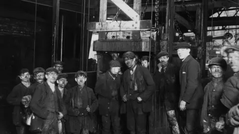 Getty Images Coal miners descending the Bargoed Mine in the early 1900s