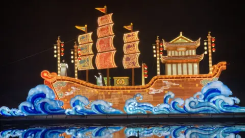 Longleat A large boat decoration, painted with a magical, oriental, feel and a dark background