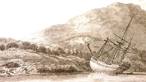 An illustration of the HMS Endeavour laid on shore